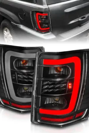 Get Yours ANZO 1999-2004 Jeep Grand Cherokee LED Tail Lights w/ Light Bar Black Housing Clear Lens