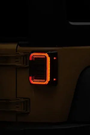 Raxiom 07-18 Jeep Wrangler JK Axial Series LED Halo Tail Lights- Black Housing (Dark Smoked Lens) Best Seller