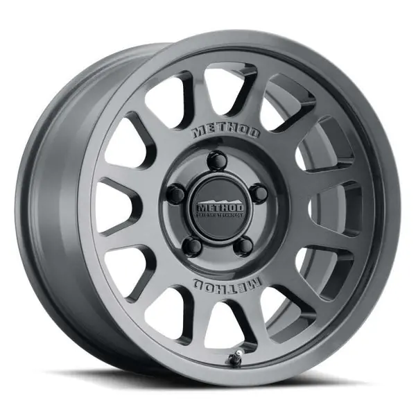Next Day Delivery Method MR703 17x9 / -12mm Offset / 106.25mm Bore / 6x5.5 BP / 4.8in BS - Gloss Titanium Wheel