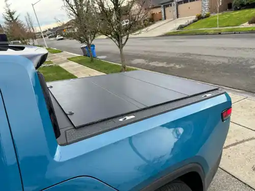 Access LOMAX Tri-Fold Cover - Matte Black - 2022-2025 Rivian R1T 4ft 6in Bed (w/ OEM Tonneau Track) - B1080019 Premium